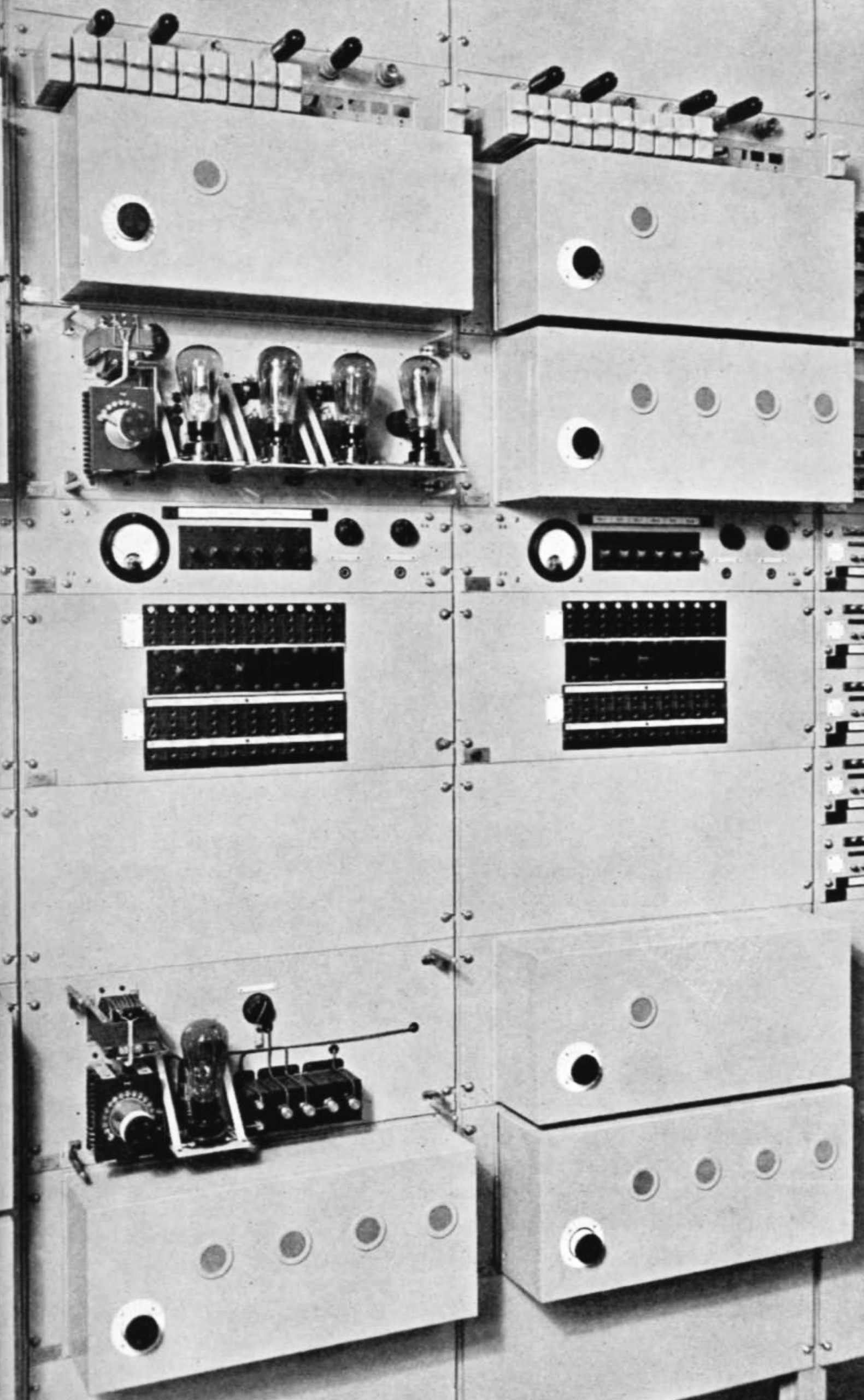 Valves, dials and control knobs on a vertical bank of equipment
